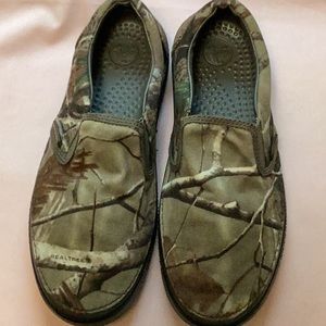 Crocs camouflage slip ons.